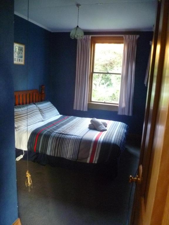 Postel nebo postele na pokoji v ubytování Hilltop Accommodation Catlins
