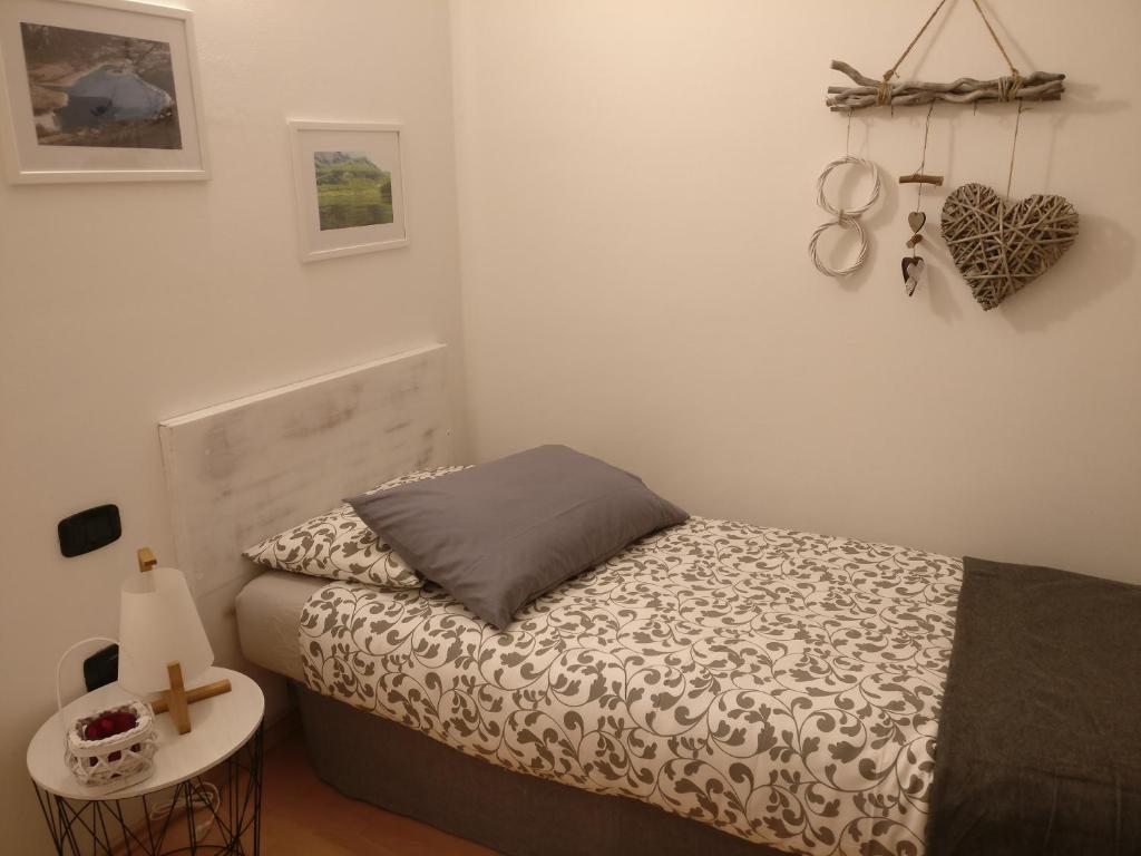 Postel nebo postele na pokoji v ubytování Garnì Al Laghet