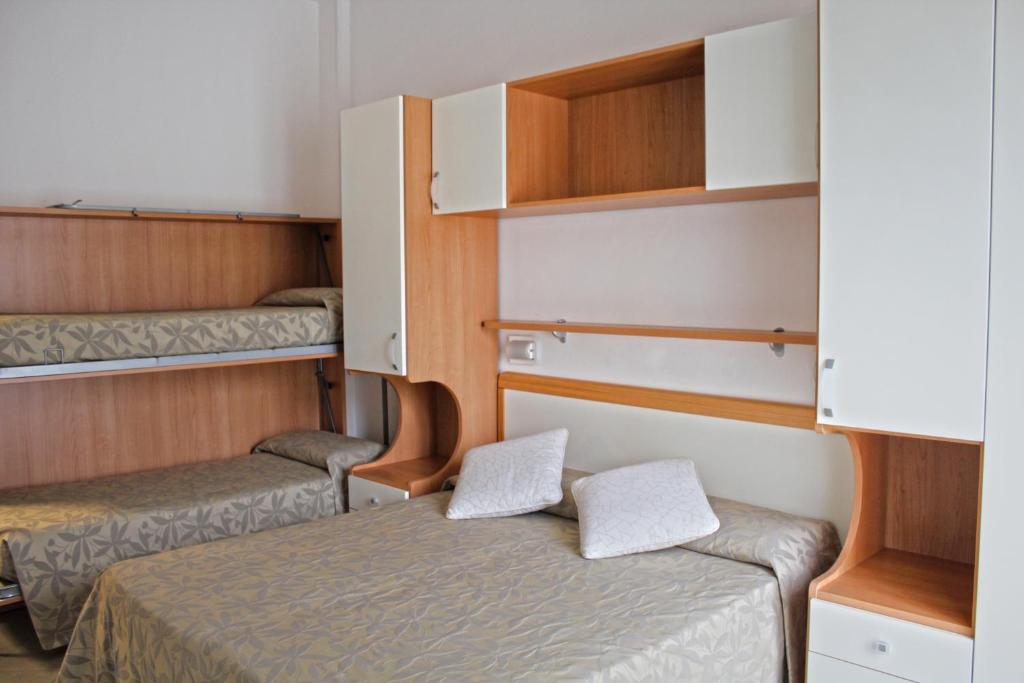 Postel nebo postele na pokoji v ubytování Hotel Trieste