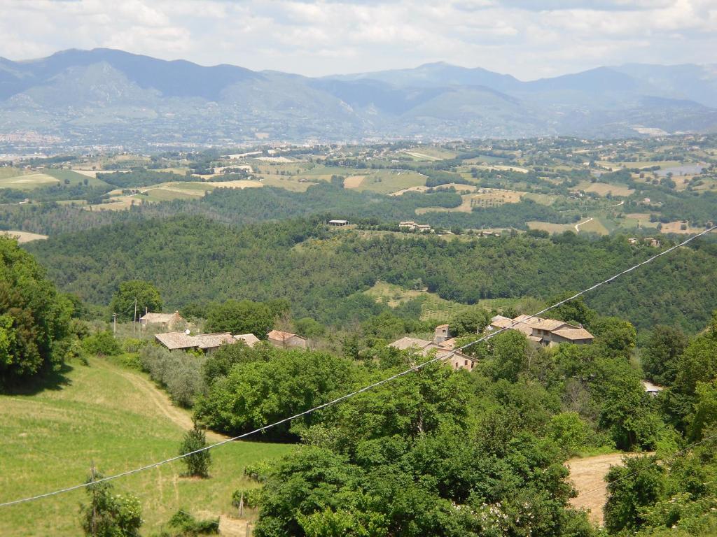 a view of a valley with mountains in the distance at Montanari Agrivillage in Narni