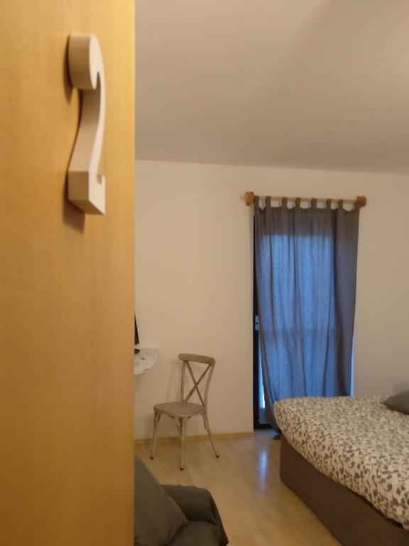 Postel nebo postele na pokoji v ubytování Garnì Al Laghet
