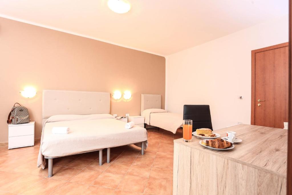 Cama ou camas em um quarto em Hotel Villa Piras