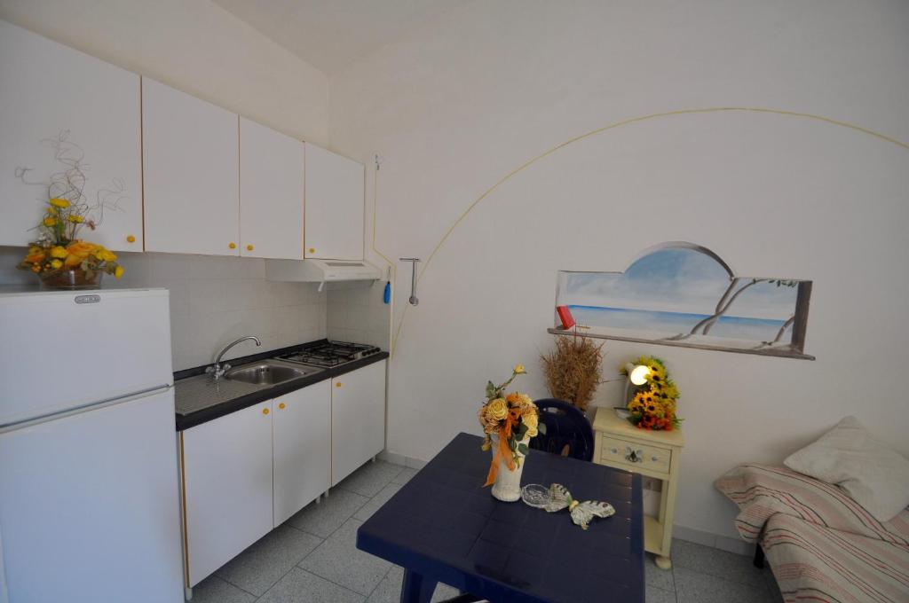 Kuchyň nebo kuchyňský kout v ubytování Residence Le Onde