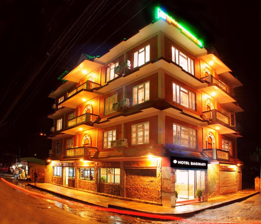 a tall building with lights on it at night at Hotel Bagmati in Kathmandu