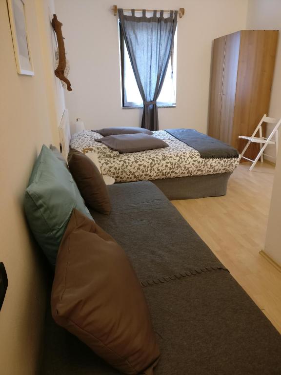 Postel nebo postele na pokoji v ubytování Garnì Al Laghet