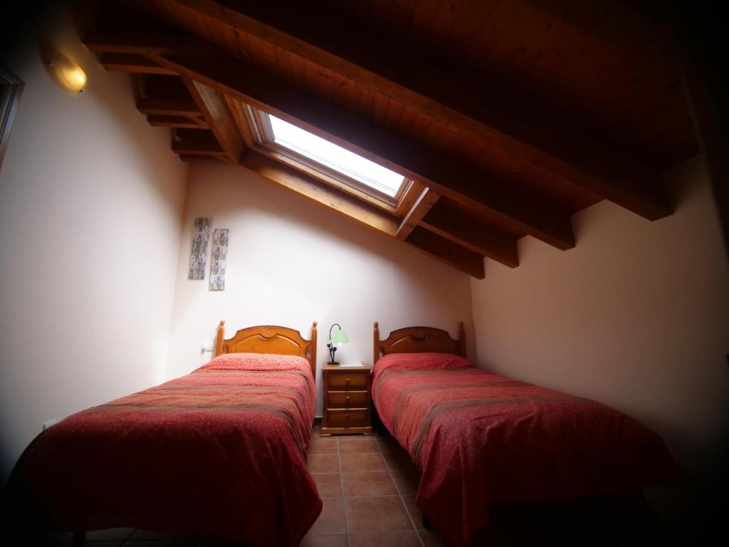 Postel nebo postele na pokoji v ubytování Albergue de Portilla