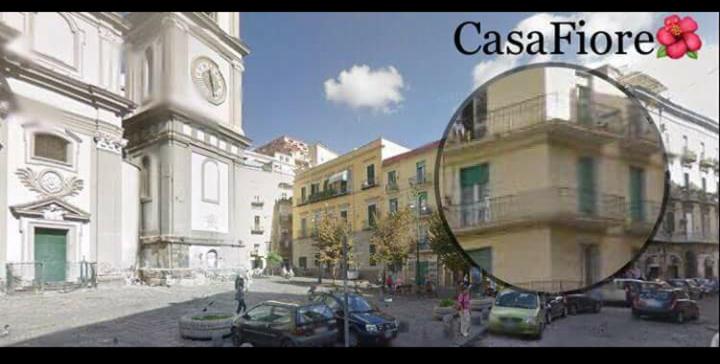 a picture of a building with a clock tower at Casa Fiore in Naples