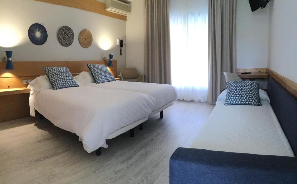 Postel nebo postele na pokoji v ubytování Hotel Yola