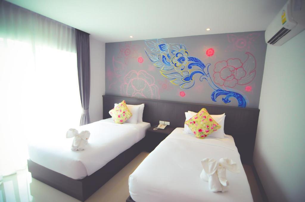 Postel nebo postele na pokoji v ubytování The Sila Hotel