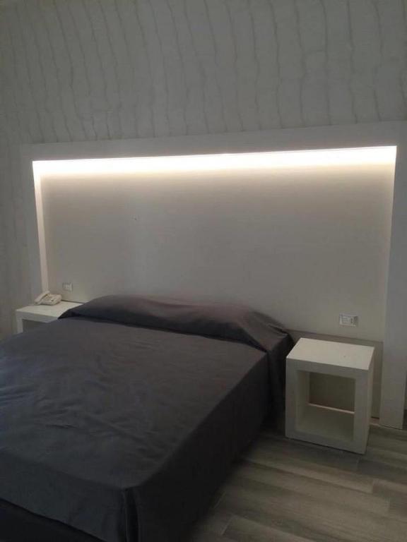 Postel nebo postele na pokoji v ubytování Hotel Paladini