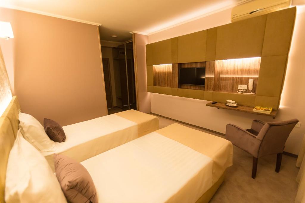 Postel nebo postele na pokoji v ubytování Hotel Orient Braila