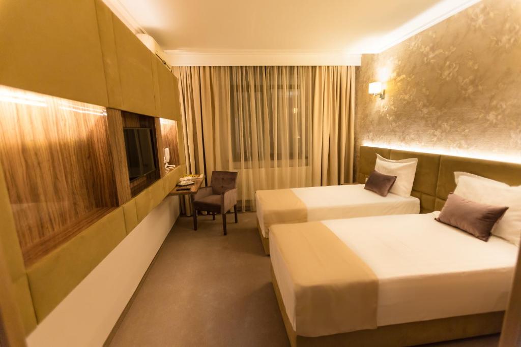 Postel nebo postele na pokoji v ubytování Hotel Orient Braila