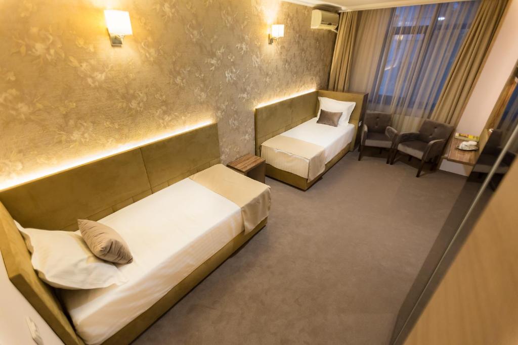 Postel nebo postele na pokoji v ubytování Hotel Orient Braila