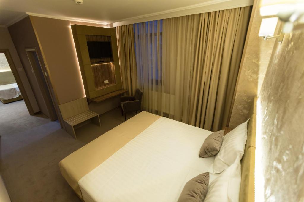 Postel nebo postele na pokoji v ubytování Hotel Orient Braila