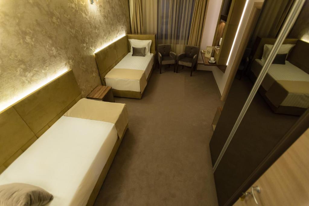 Postel nebo postele na pokoji v ubytování Hotel Orient Braila