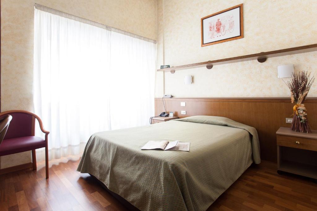 Letto o letti in una camera di Residence Desenzano