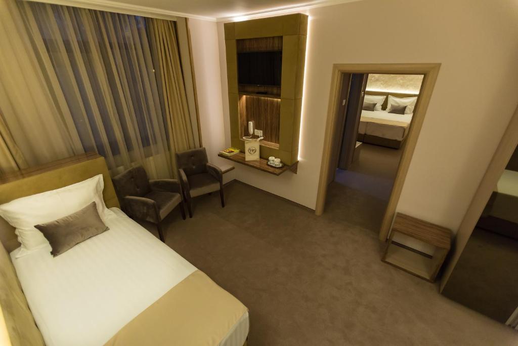 Postel nebo postele na pokoji v ubytování Hotel Orient Braila