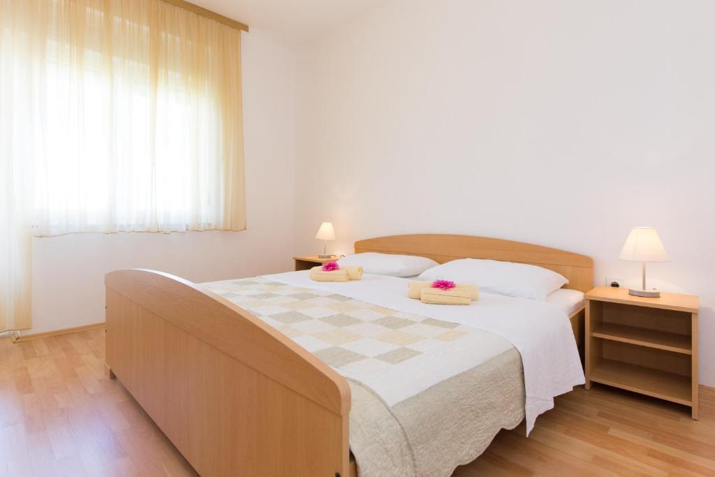 Posteľ alebo postele v izbe v ubytovaní Apartments Andrea V