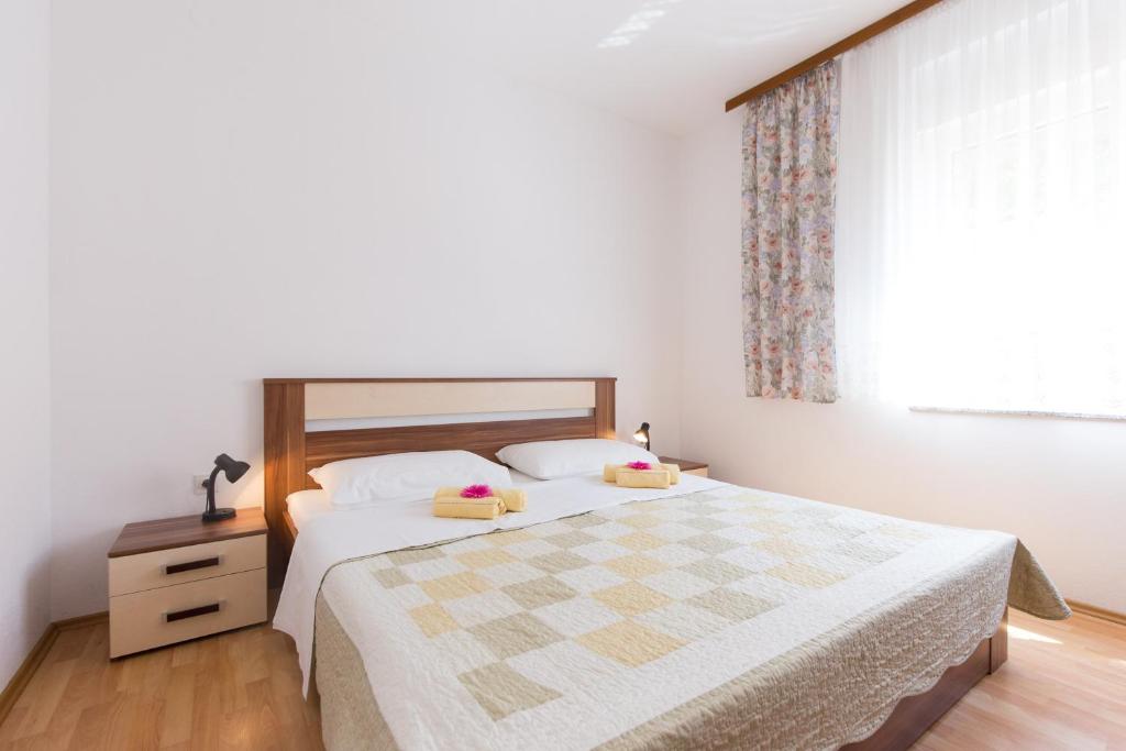 Posteľ alebo postele v izbe v ubytovaní Apartments Andrea V