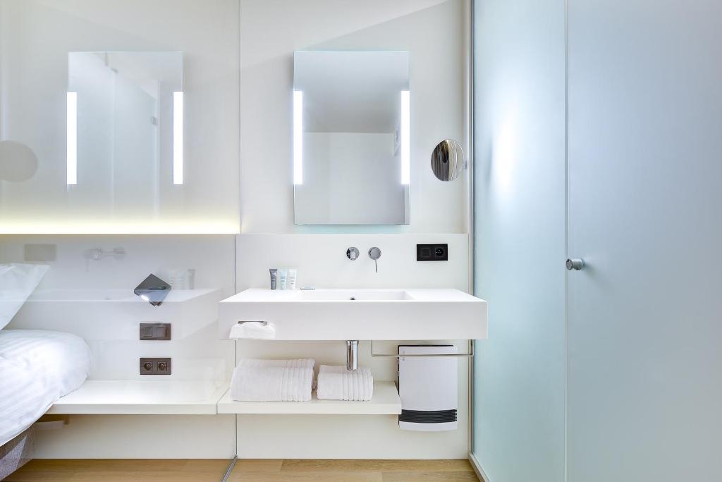 Postel nebo postele na pokoji v ubytování R hotel experiences