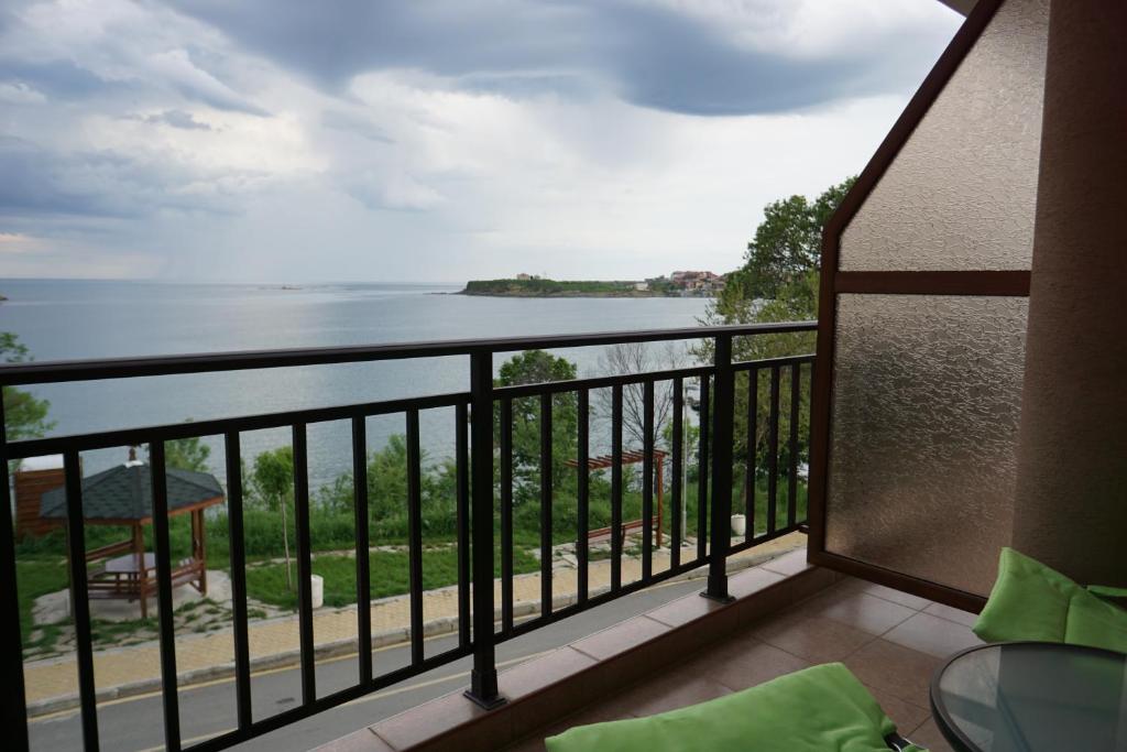 a balcony with a view of the water at Studios Grace - Port Tsarevo in Tsarevo