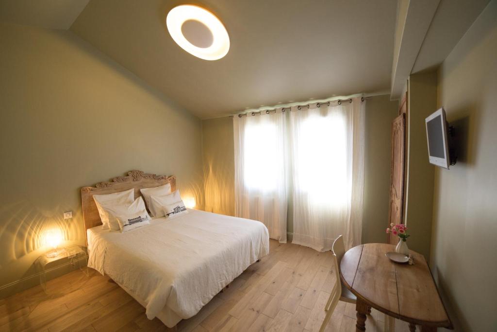 Postel nebo postele na pokoji v ubytování Chambre d'Hôtes Arima