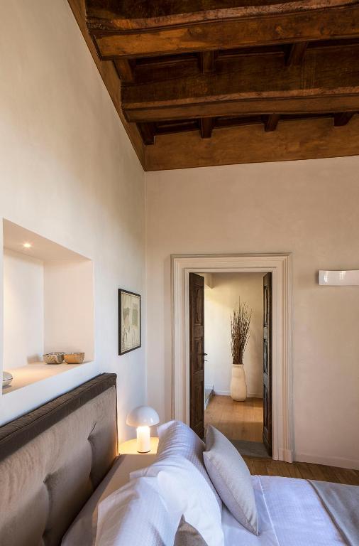 Postel nebo postele na pokoji v ubytování Relais Villa del Borgo