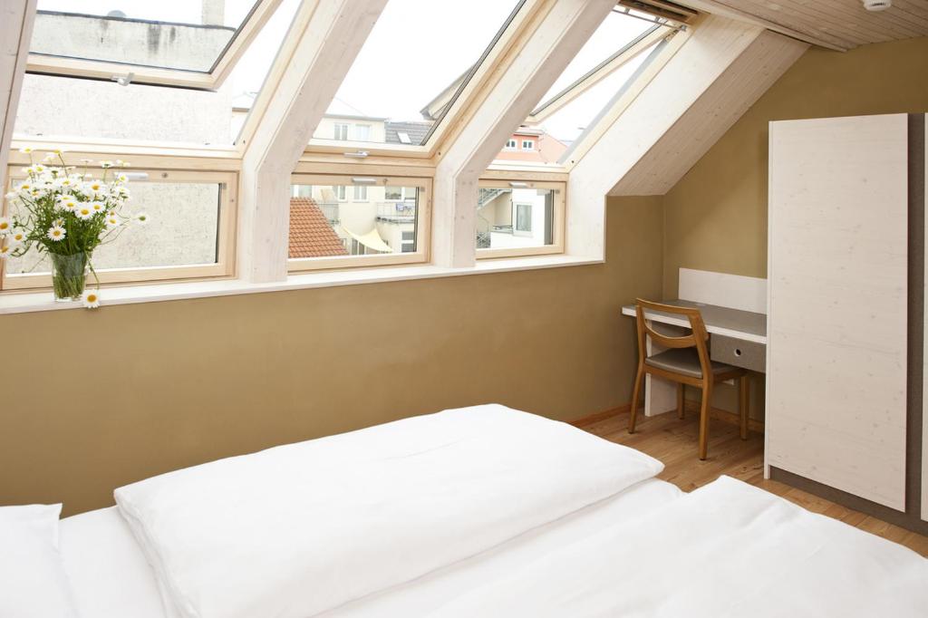 Postel nebo postele na pokoji v ubytování Familienhotel Weimar mit Ferienwohnungen
