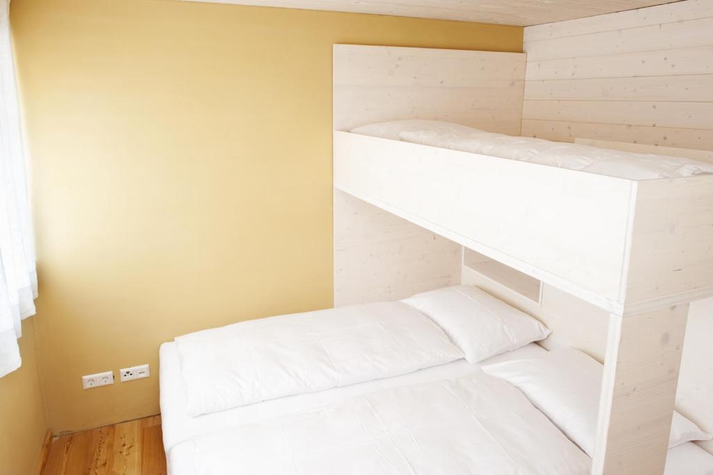 Postel nebo postele na pokoji v ubytování Familienhotel Weimar mit Ferienwohnungen