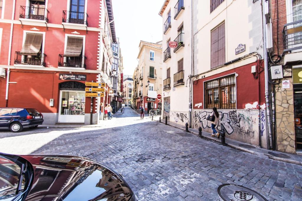 a view of a cobblestone street in a city at Apartamento Completo Boquerón de Granada in Granada