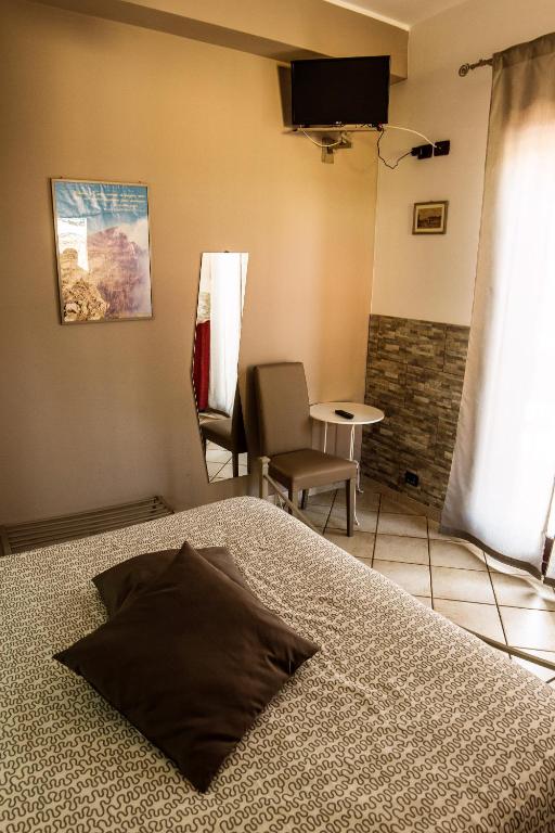Postel nebo postele na pokoji v ubytování Sotto Il Vulcano