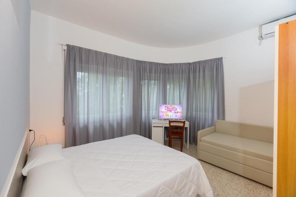 Postel nebo postele na pokoji v ubytování Hotel Costa Verde