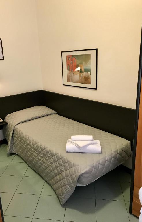 Postel nebo postele na pokoji v ubytování Hotel St Pierre