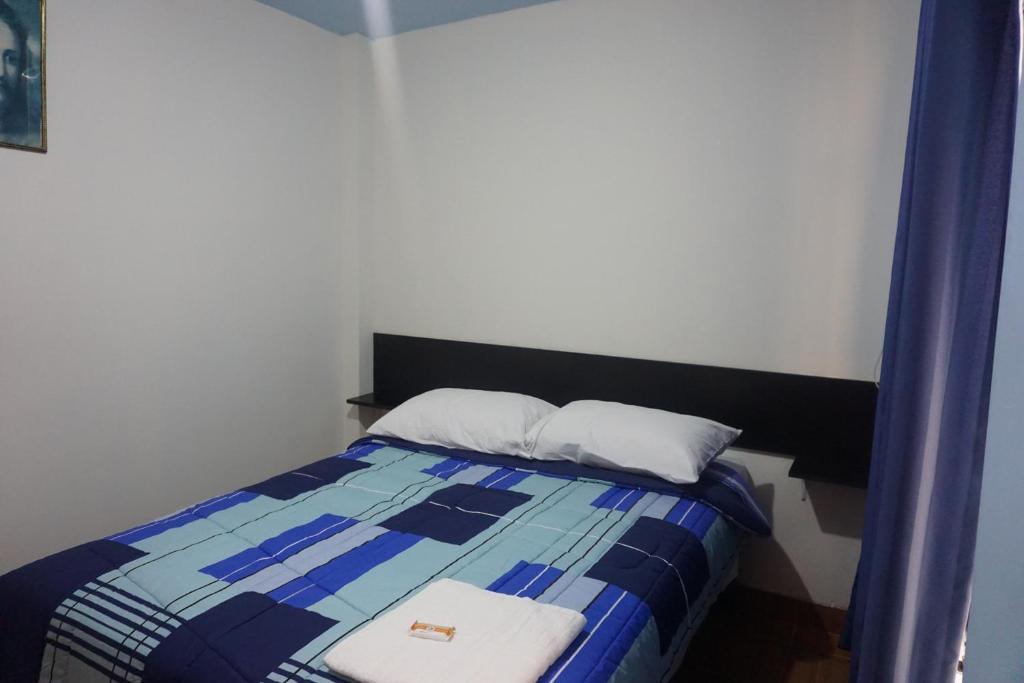 Postel nebo postele na pokoji v ubytování Residencial Mamamia