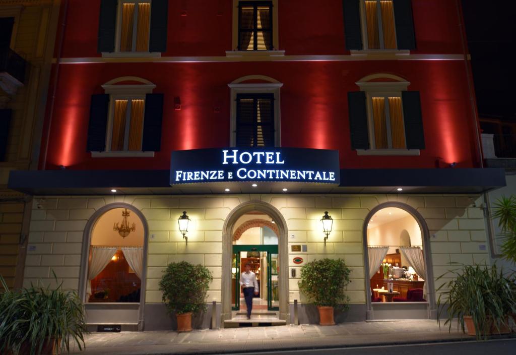 a hotel with a sign that reads hotel therapy and complimentary at Hotel Firenze e Continentale in La Spezia