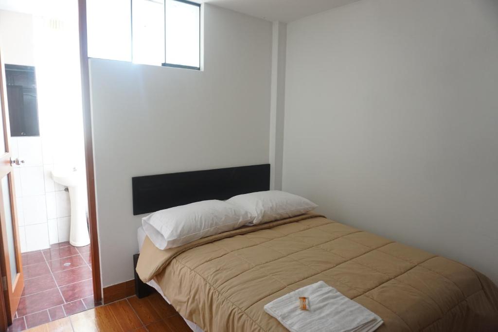 Postel nebo postele na pokoji v ubytování Residencial Mamamia