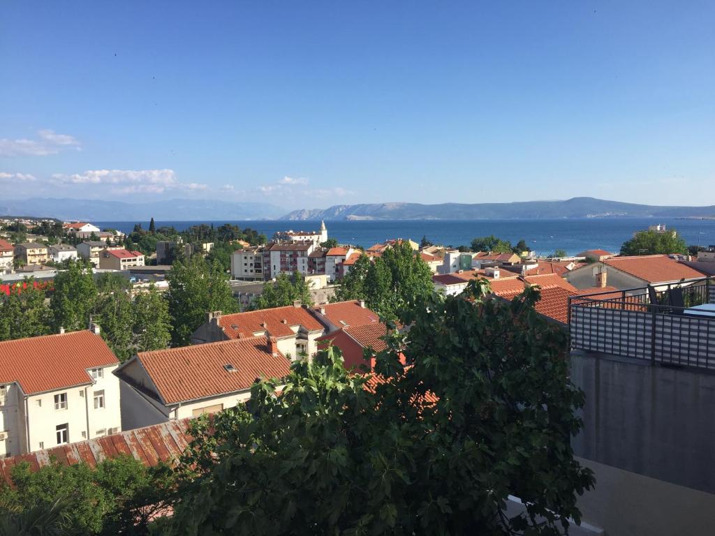 a view of a city with buildings and the ocean at Central House Nona in Crikvenica