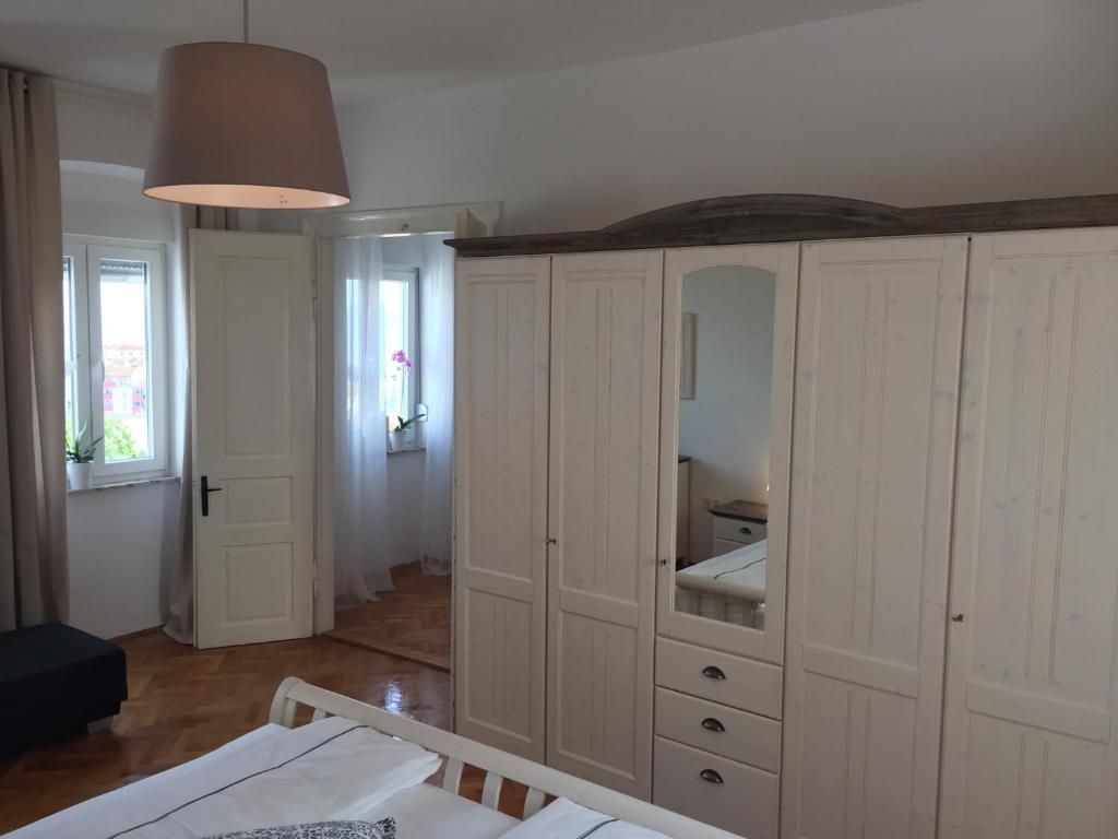 Postel nebo postele na pokoji v ubytování Central House Nona
