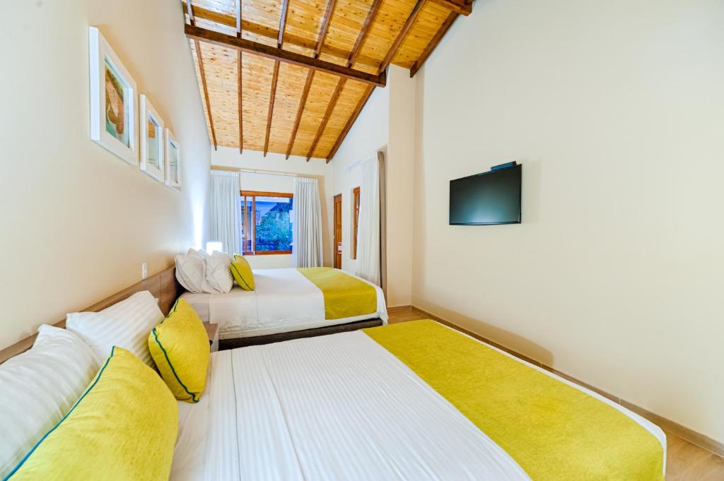 Una cama o camas en una habitación de Hotel Campestre La Potra