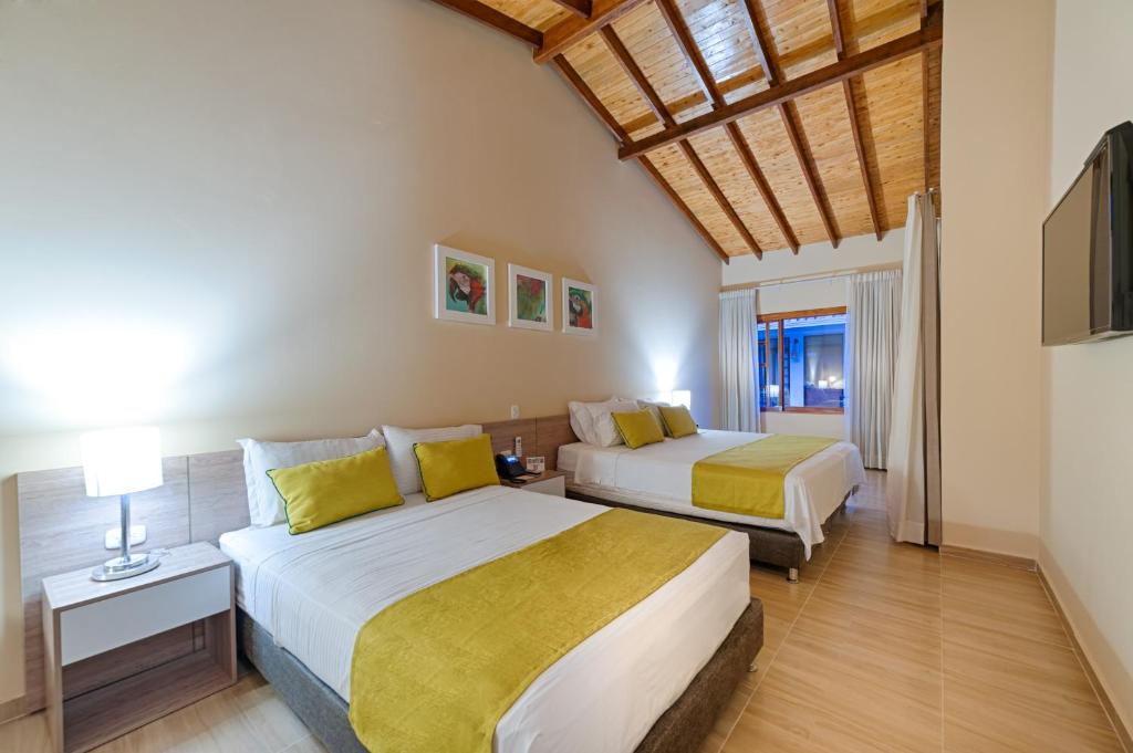 Una cama o camas en una habitación de Hotel Campestre La Potra