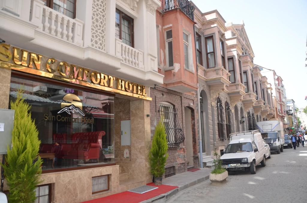 a street with a store on the side of a building at Sun Comfort Hotel in Istanbul