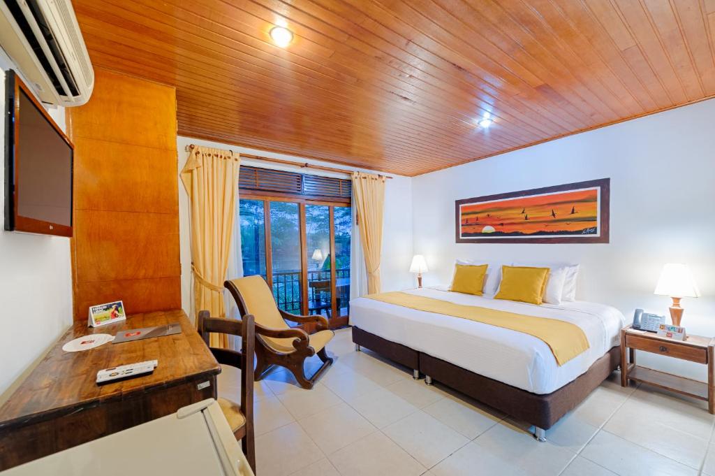 Una cama o camas en una habitación de Hotel Campestre La Potra