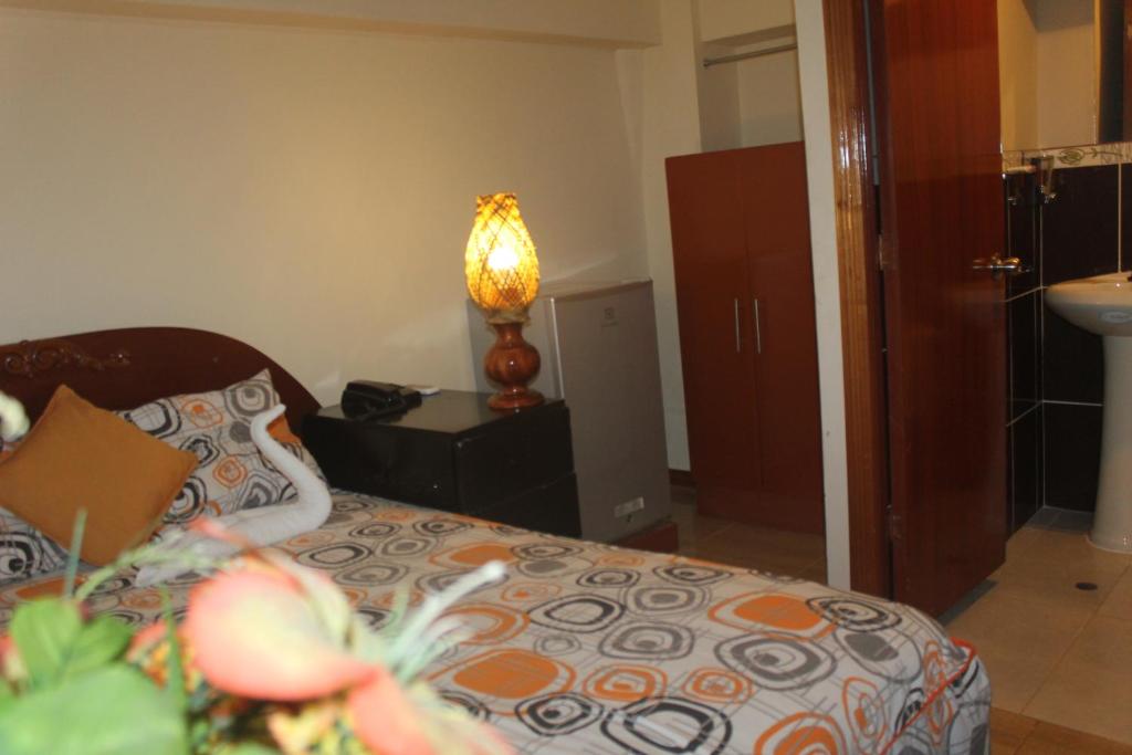 Una cama o camas en una habitación de Hostal Ventura Isabel