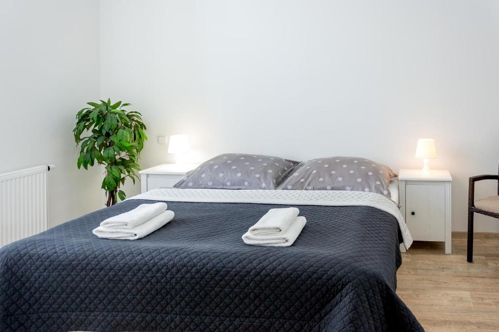 Postel nebo postele na pokoji v ubytování Penzion Apartmány Hradební
