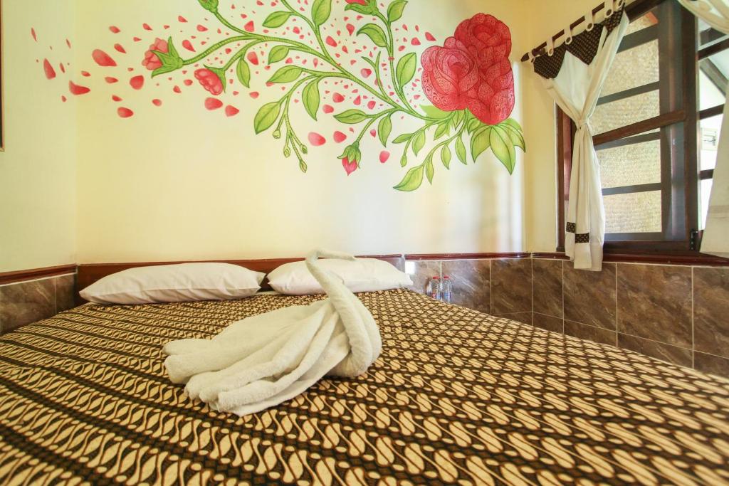 Postel nebo postele na pokoji v ubytování Delta Homestay