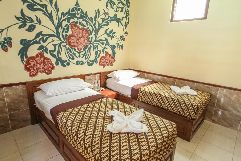 Postel nebo postele na pokoji v ubytování Delta Homestay