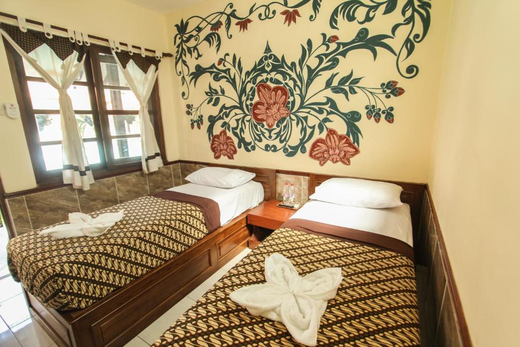 Postel nebo postele na pokoji v ubytování Delta Homestay