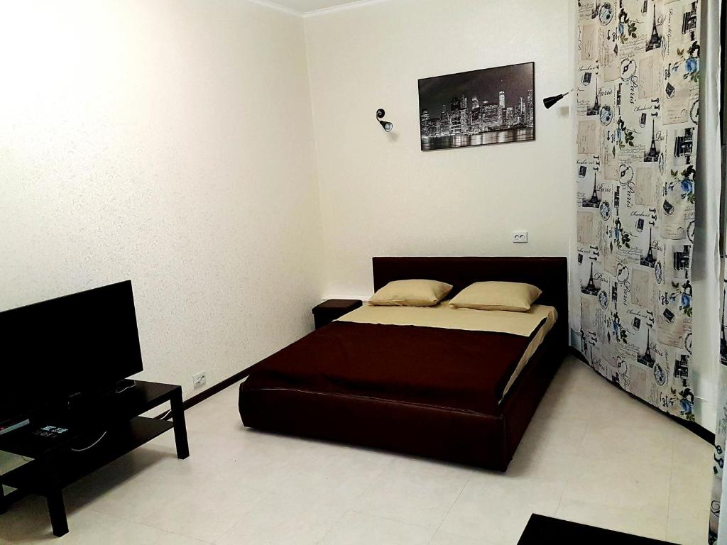 
Кровать или кровати в номере Апартаменты с двумя спальнями на Островского

