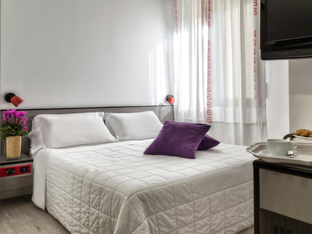 Postel nebo postele na pokoji v ubytování Hotel Boemia