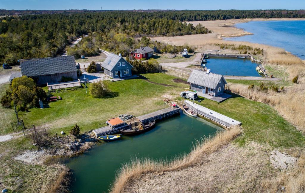 an aerial view of a house and a boat in the water at Kassariotsa Holiday House in Kassari